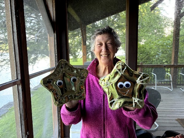 Carrie Elderberry holding two finished star puppets