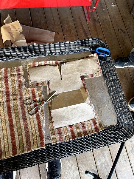 Fabric cut using the paper bag pattern, with scissors visible