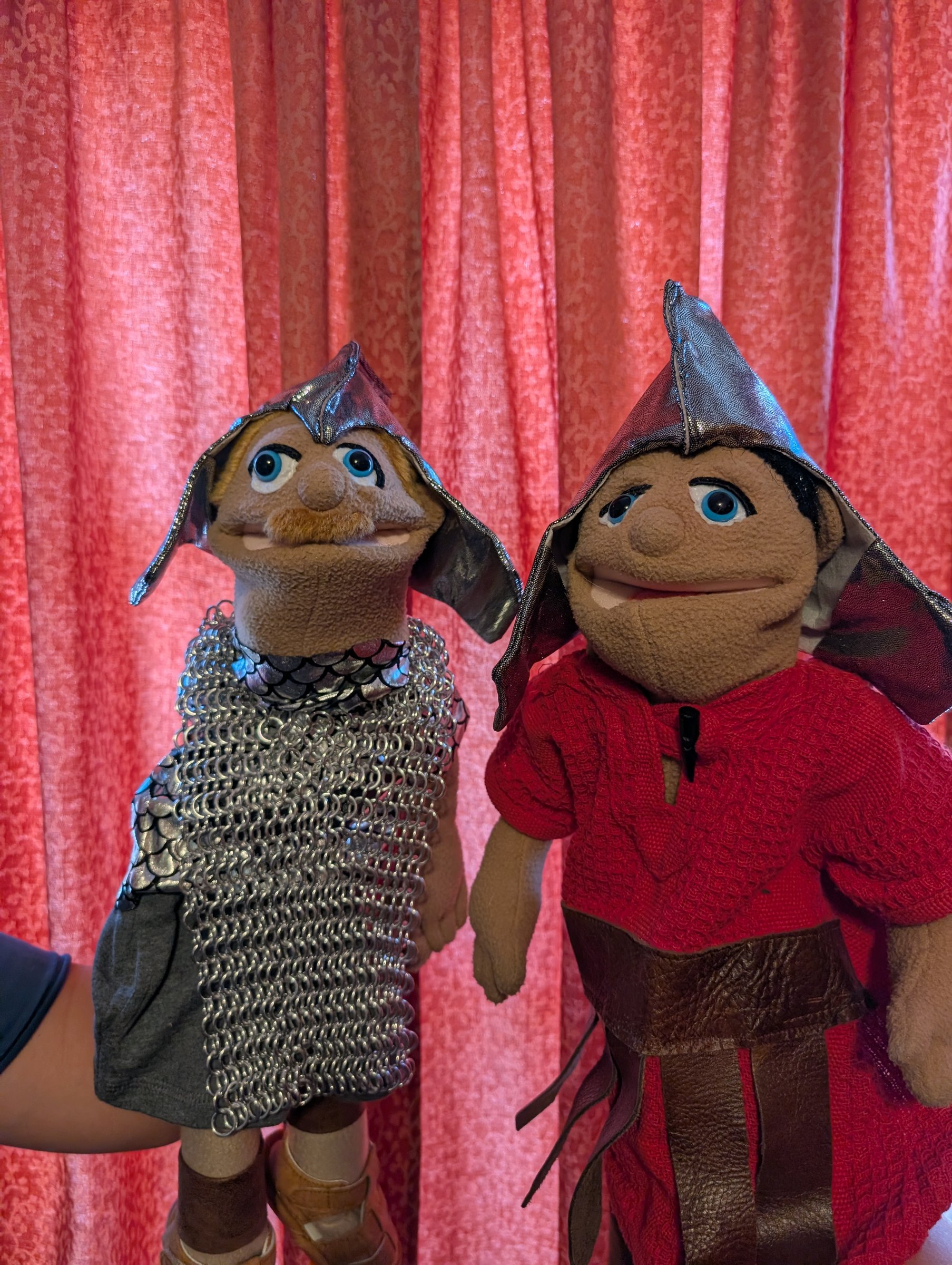 Two Roman soldier puppets in costume